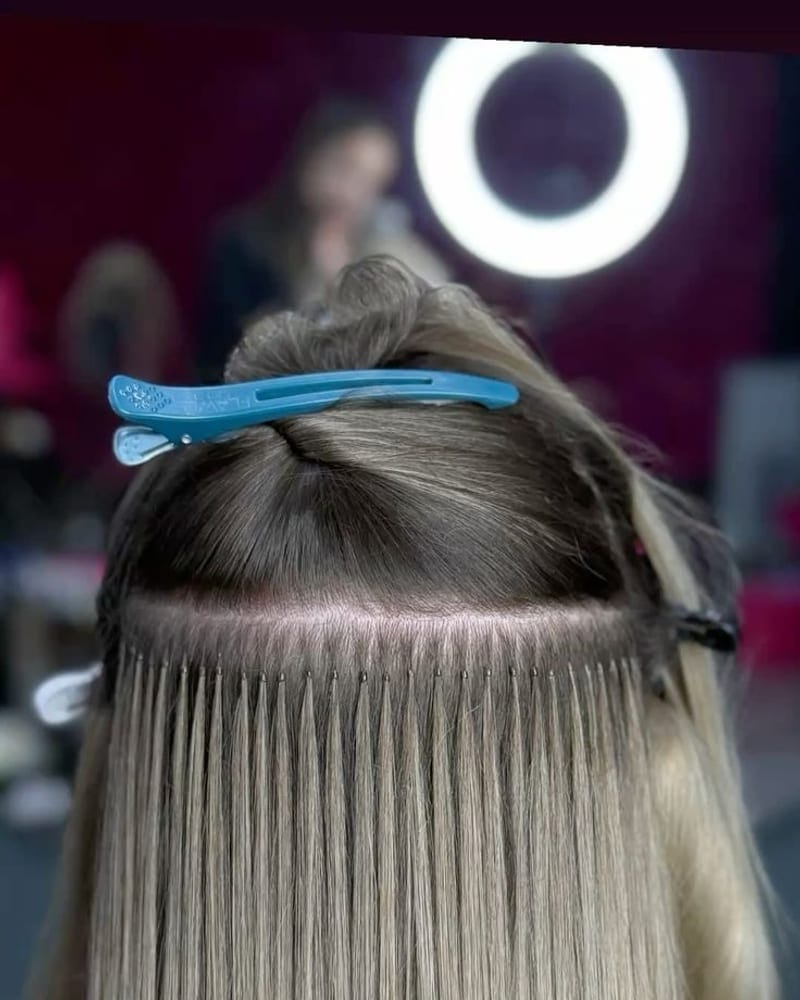 Individual keratin-bonded strands fused close to the root, lying flat against the hair