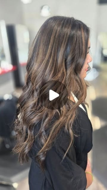 Balayage highlights through long brunette hair