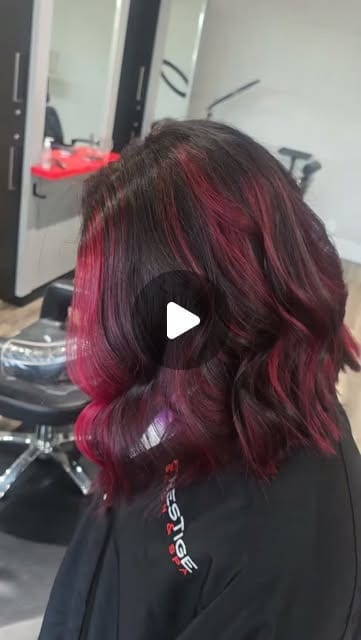 A subtle pop of fashion color through long hair at the end of summer