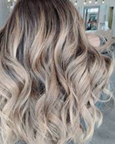 Hand-painted balayage highlights blended through long hair