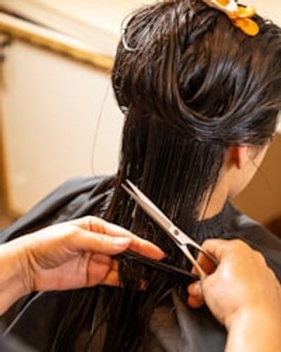 A finished haircut styled with a smooth blow-dry
